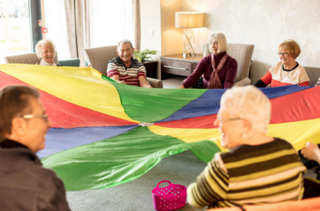 Residents playing the parachute exercise game at Casa di Lusso Care Home, Bridgwater